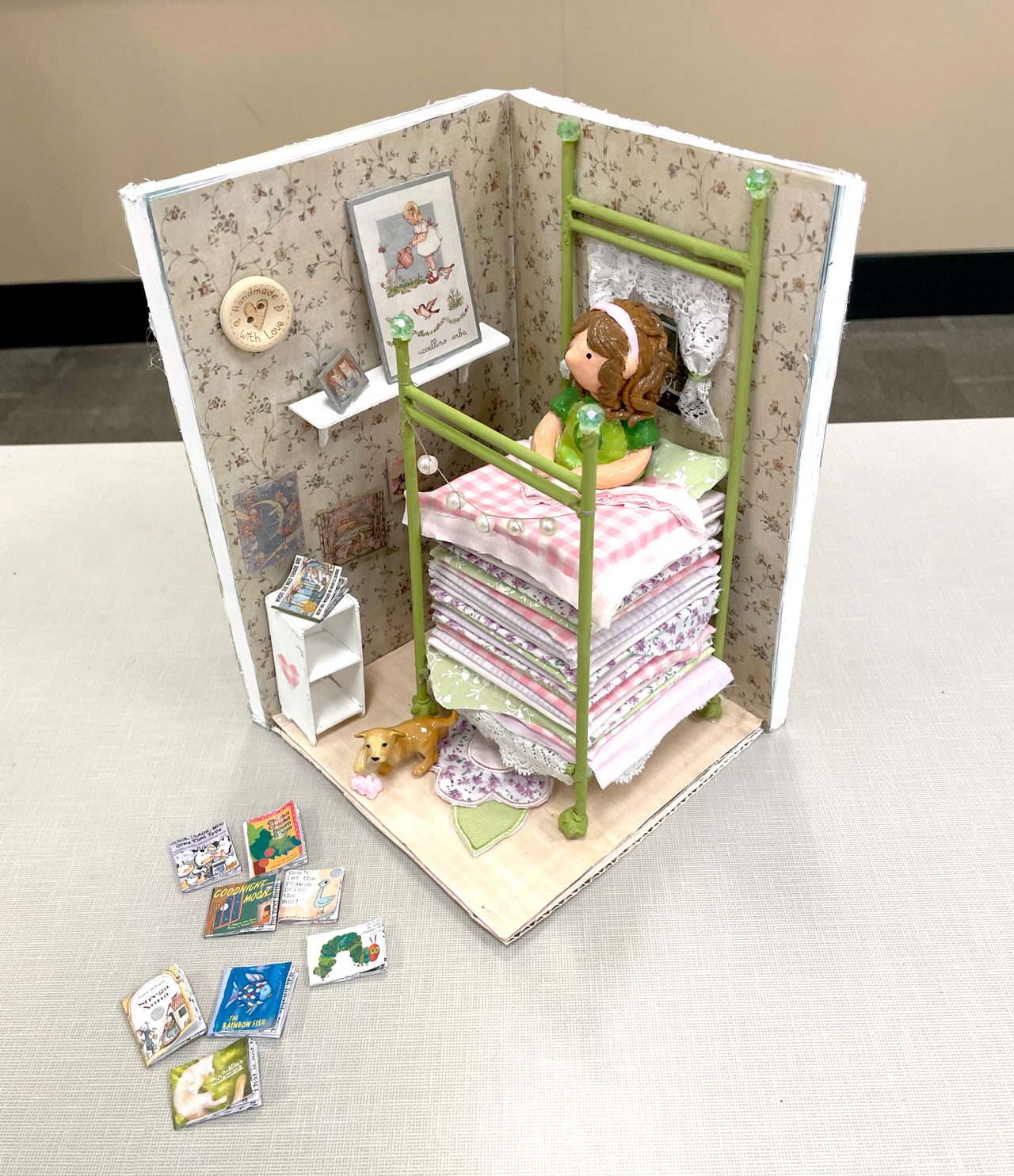 Ohio University - Fall 2025 Student: Hannah Lisk 9.5"x8" Self-Portrait - Air Dry Clay, Wood, Fabric, Paper